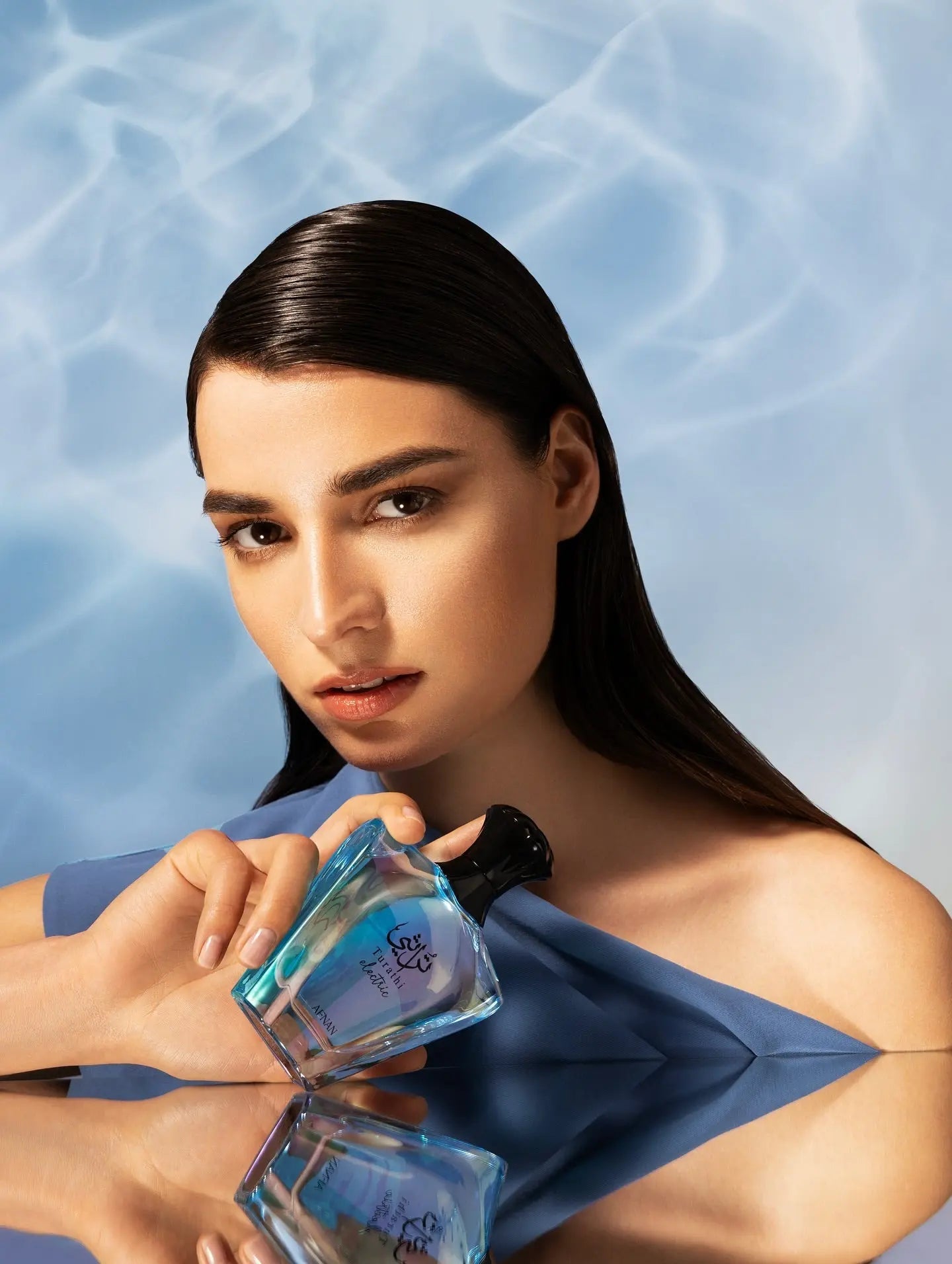 https://cdn.shopify.com/s/files/1/0798/6898/5693/files/Turathi-Electric-Perfume-90ml-EDP-Afnan-169994991.jpg?v=1750967063